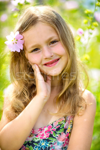 stock photo: portrait of a little girl in wreath of flowers