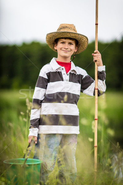 Young boy fishing in a river Stock photo © bloodua