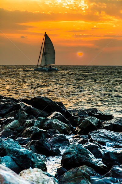 Yacht sailing against sunset. Holiday lifestyle landscape with s Stock photo © bloodua