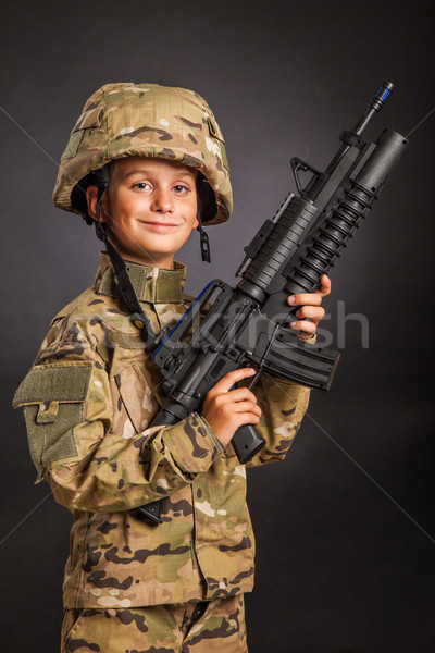 Young soldier with rifle Stock photo © bloodua