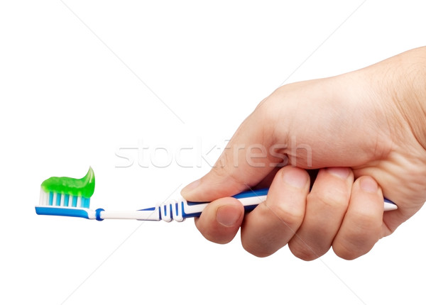Tandenborstel tandpasta hand geïsoleerd witte achtergrond Stockfoto © bloodua
