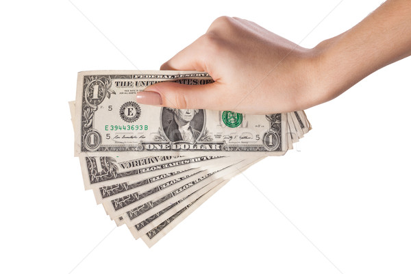 Female hand holding money dollars isolated on white background Stock photo © bloodua