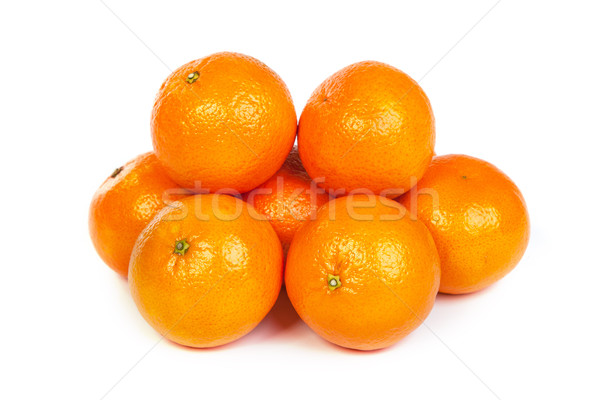 Group of ripe tangerine or mandarin with slices on white Stock photo © bloodua