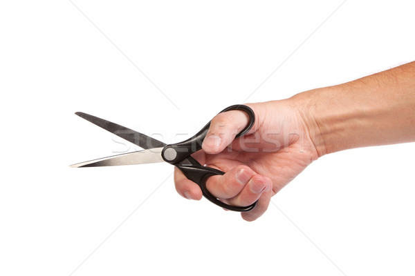 Stock photo: Hand is holding scissors isolated