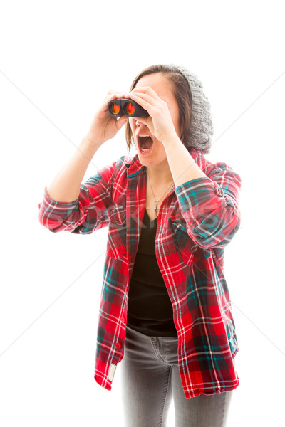 Young woman looking through binoculars and shock Stock photo © bmonteny