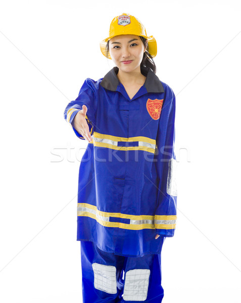 Lady firefighter giving hand for handshake isolated on white background Stock photo © bmonteny