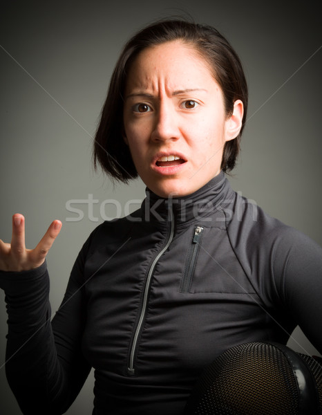 Female fencer wearing fencing uniform gesturing with shrugging Stock photo © bmonteny