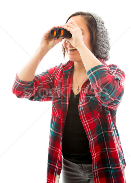 Young woman looking through binoculars Stock photo © bmonteny
