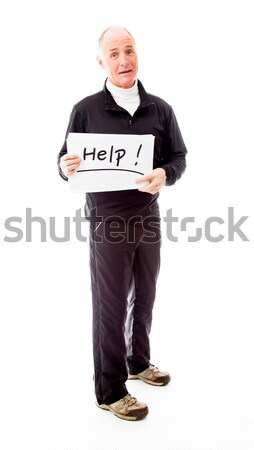 Senior man standing with arms akimbo and smiling Stock photo © bmonteny