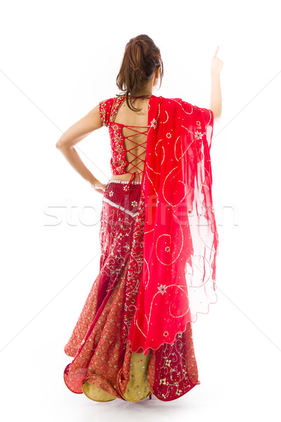 Young Indian woman pretending to work on touch screen Stock photo © bmonteny