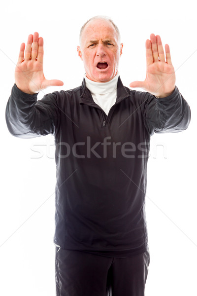 Stock photo: Senior man stopping with hand gesture