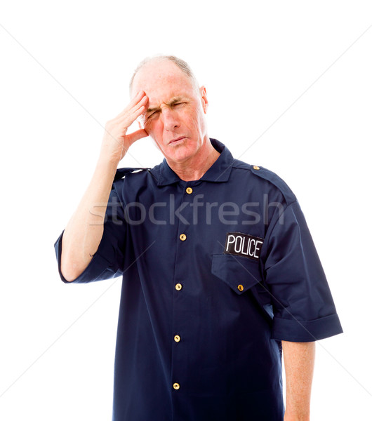 Policeman suffering from headache Stock photo © bmonteny