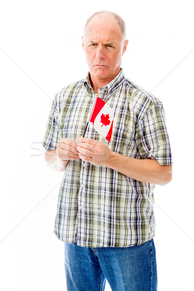 Senior man holding a Canadian flag Stock photo © bmonteny