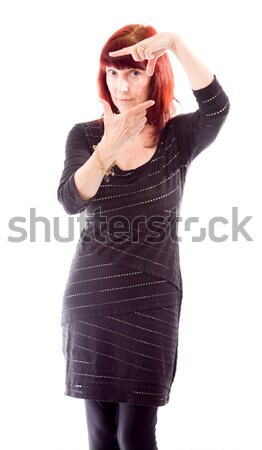 Mature woman making frame with fingers Stock photo © bmonteny