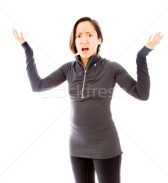 Worried woman spread hands and doesn't know what to do Stock photo © bmonteny