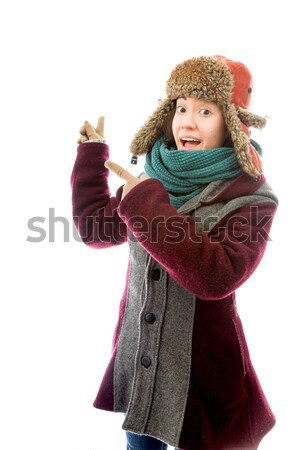 Young woman in warm clothing with her fingers crossed Stock photo © bmonteny