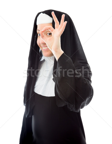 Young nun showing ok sign and smiling Stock photo © bmonteny