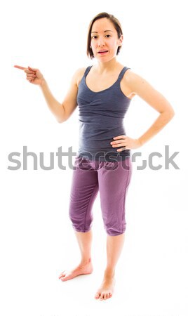 Young woman pointing her finger up Stock photo © bmonteny