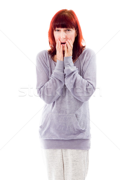 Mature woman with hand over her mouth and shock Stock photo © bmonteny