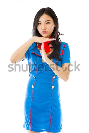 Asian air stewardess pointing finger to head Stock photo © bmonteny