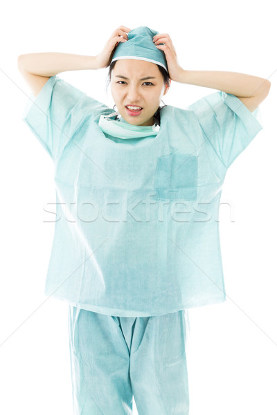 Frustrated Asian female surgeon screaming Stock photo © bmonteny