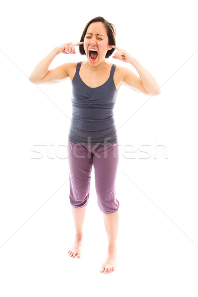 Young woman with fingers in her ears Stock photo © bmonteny