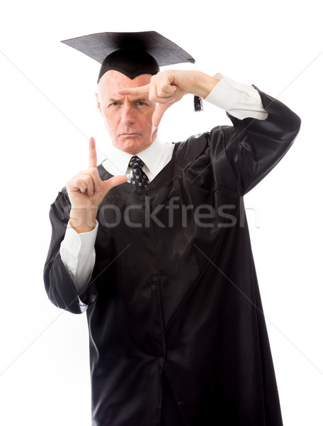 Senior male graduate framing face with fingers Stock photo © bmonteny