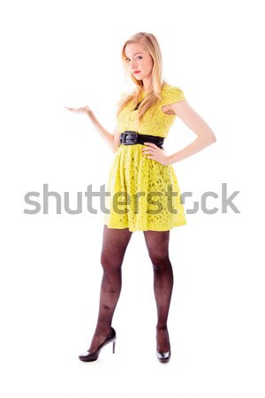 Beautiful young woman standing with her arm outstretched Stock photo © bmonteny