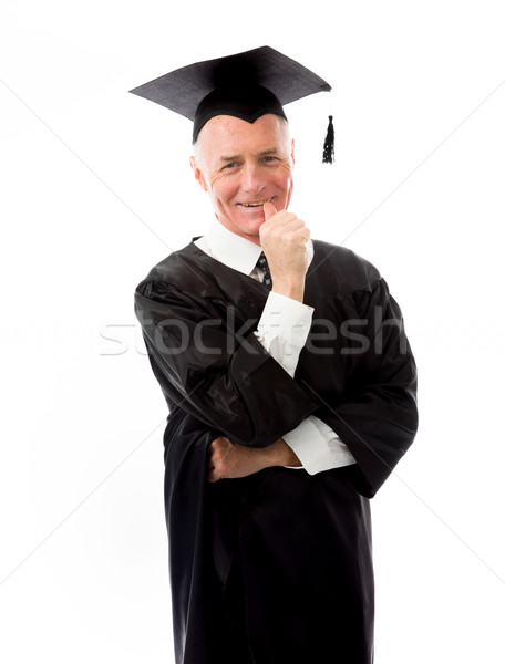 Senior male graduate standing with finger in mouth Stock photo © bmonteny