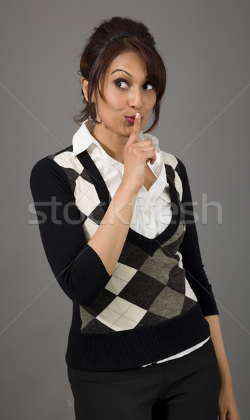 Indian businesswoman with finger on lips Stock photo © bmonteny