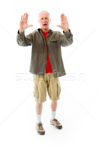 Senior man stopping with hand gesture Stock photo © bmonteny