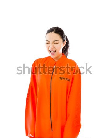 Young Asian woman shouting in excitement and wearing prisoners uniform Stock photo © bmonteny