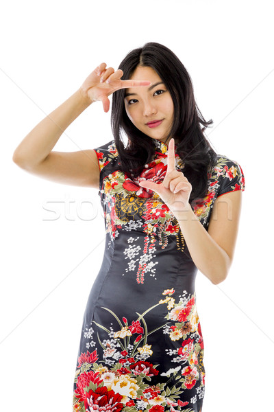 Asian young woman looking through finger frame Stock photo © bmonteny