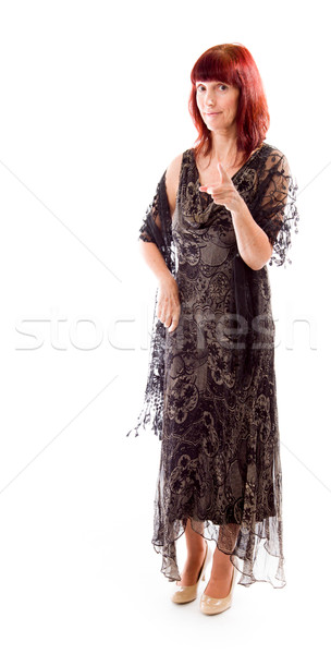 Mature woman pointing towards camera Stock photo © bmonteny
