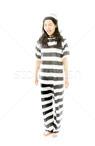Young Asian woman shouting in excitement and wearing prisoners uniform Stock photo © bmonteny