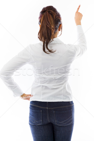 Rear view of an Indian young woman pretending to working on virtual screen Stock photo © bmonteny