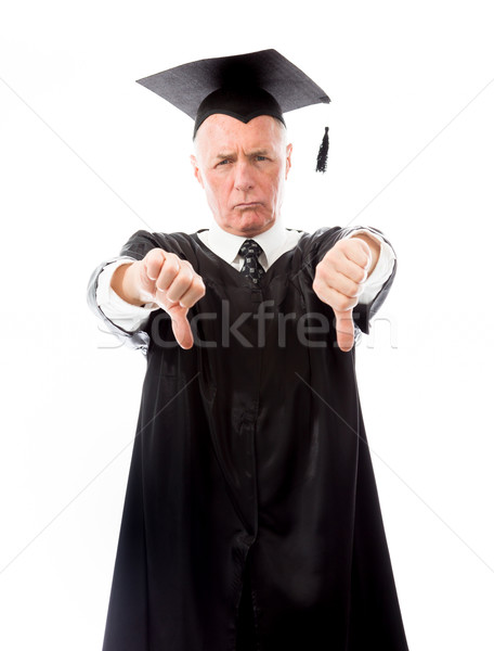 Stock photo: Senior male graduate making thumbs down sign with both hands