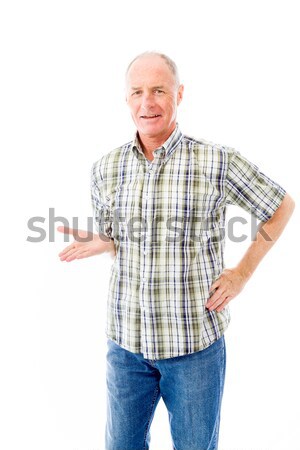 Senior man standing with arms akimbo and thinking Stock photo © bmonteny