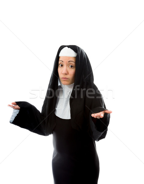 Young nun gesturing and shrugging Stock photo © bmonteny