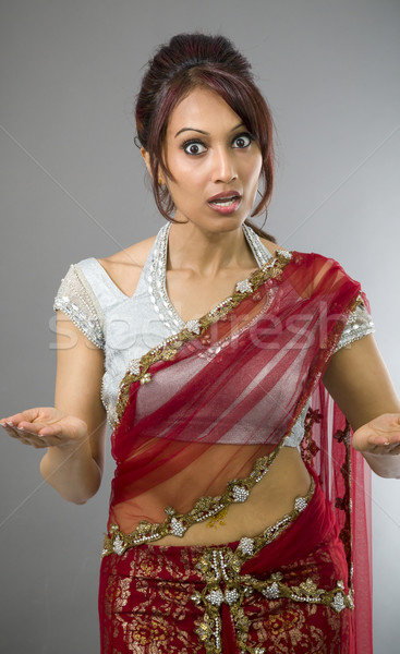 Young Indian woman looking shocked Stock photo © bmonteny