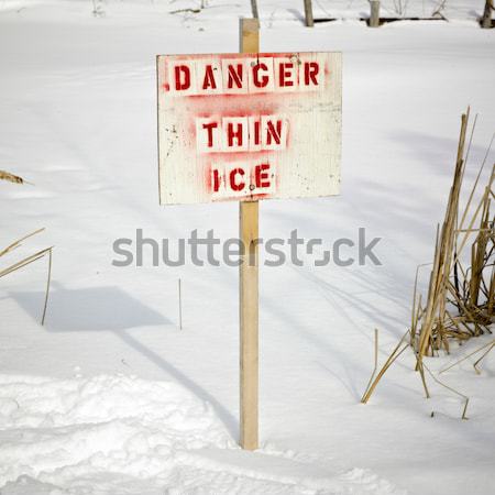 Warning sign of 'THIN ICE' at lakeside, Orangeville, Dufferin Co Stock photo © bmonteny