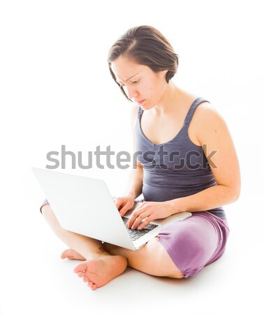 Young woman sitting on floor using laptop Stock photo © bmonteny