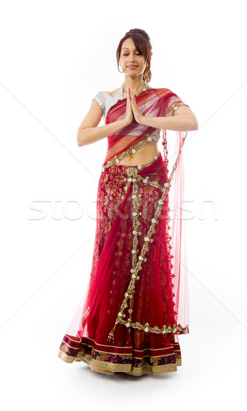 Young Indian woman standing in prayer position Stock photo © bmonteny