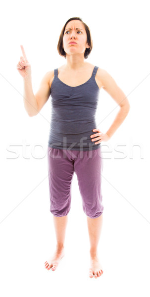 Young woman pointing her finger and thinking Stock photo © bmonteny