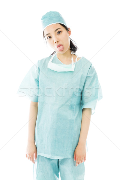 商業照片: 亞洲的 · 女 · 外科醫生 · 出 · 舌頭 · 相機