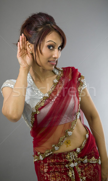 Young Indian woman trying to listen Stock photo © bmonteny