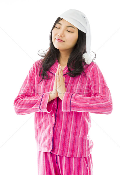 Young Asian woman standing in prayer position Stock photo © bmonteny