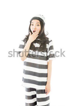 Young Asian woman with finger on chin in prisoners uniform Stock photo © bmonteny