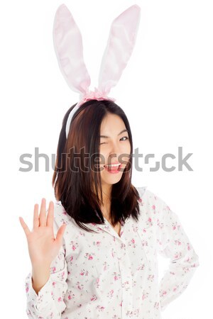 Portrait of sexy asian cowgirl ready for easter thumbs up Stock photo © bmonteny