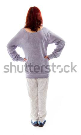 Rear view of a mature woman standing with her arms akimbo Stock photo © bmonteny